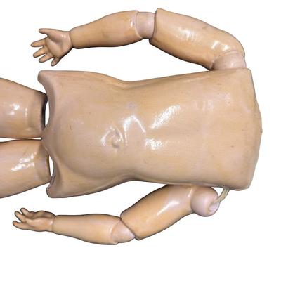Sale Photo Thumbnail #380: This doll body is missing the head. It is made of bisque. Includes a dress and knickers. Age related wear. Measurement: 20”L (without head). Pre-auction: $50-$100. [SR]