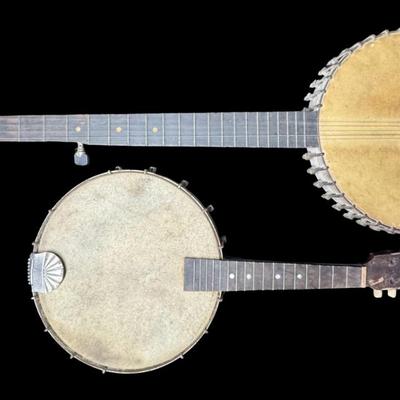 Sale Photo Thumbnail #388: Includes a mandolin banjo, and what is believed to be a 19th century J.H. Buckbee banjo. Both are nickel plated, open back banjos. Both need to be repaired. Measurement of largest: 35”L. [KD]