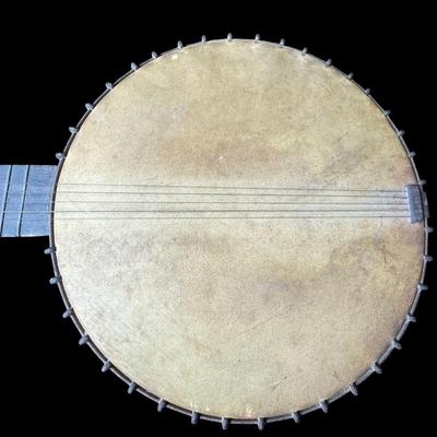 Sale Photo Thumbnail #389: Includes a mandolin banjo, and what is believed to be a 19th century J.H. Buckbee banjo. Both are nickel plated, open back banjos. Both need to be repaired. Measurement of largest: 35”L. [KD]