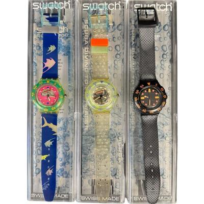 Sale Photo Thumbnail #407: Includes watches from the late 1980s or early 1990s. Both men’s and ladies’ pieces. These have easy to remove battery compartments. Total of ten watches and one spare band. The band on one of the watches is broken. Not tested. [RY]