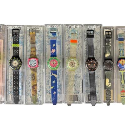 Sale Photo Thumbnail #405: Includes watches from the late 1980s or early 1990s. Both men’s and ladies’ pieces. These have easy to remove battery compartments. Total of ten watches and one spare band. The band on one of the watches is broken. Not tested. [RY]