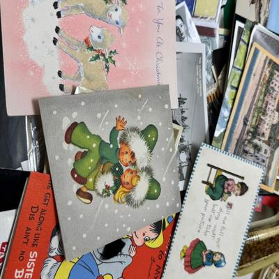 Sale Photo Thumbnail #24: Prohibito El Paso! Cook books, post cards, collection of unused vintage cat them Christmas cards, resin 1970 spoon holders with dried plants. Brochures, 1960's kids artwork. Classic wrapping paper sheets.1940s 1950s humorous cards, brochures.