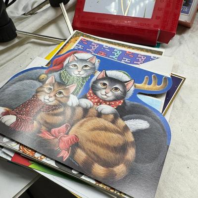 Sale Photo Thumbnail #28: Prohibito El Paso! Cook books, post cards, collection of unused vintage cat them Christmas cards, resin 1970 spoon holders with dried plants. Brochures, 1960's kids artwork. Classic wrapping paper sheets.1940s 1950s humorous cards, brochures.