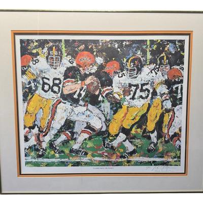 Sale Photo Thumbnail #424: This depicts a scene from a game with the Pittsburgh Steelers and the Cincinnati Bengals. It is pencil signed and numbered 615/1000. There is an original COA on the back. Age related wear. Measurement: 29”W x 25”H. Pre-auction estimate: $50-$100. [RS]