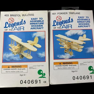 Sale Photo Thumbnail #467: Includes two metal GI Joe lunchboxes, two Legends of the Air wood models (NOS), three model planes, a poster, and more. Total of nine pieces. The planes need repair and/or have missing pieces. [JS]