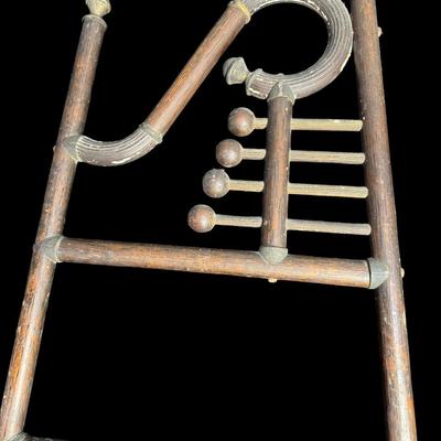 Sale Photo Thumbnail #486: These pieces each feature a classic Art Deco motif at the top. They are constructed of wood, with metal art holders. There is age related wear to both, including some loose hardware and warping. These are nice period pieces. Measurement: 66”H x 20”W a