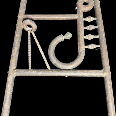 Sale Photo Thumbnail #485: These pieces each feature a classic Art Deco motif at the top. They are constructed of wood, with metal art holders. There is age related wear to both, including some loose hardware and warping. These are nice period pieces. Measurement: 66”H x 20”W a