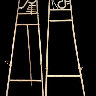 Sale Photo Thumbnail #483: These pieces each feature a classic Art Deco motif at the top. They are constructed of wood, with metal art holders. There is age related wear to both, including some loose hardware and warping. These are nice period pieces. Measurement: 66”H x 20”W a