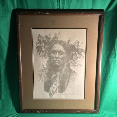 Sale Photo Thumbnail #75: Framed artwork featuring a detailed drawing of an Indigenous figure, created using pencil or charcoal. The piece appears to depict traditional elements, including feathers and braided hair. The drawing is surrounded by a matboard and enclosed in a wooden 