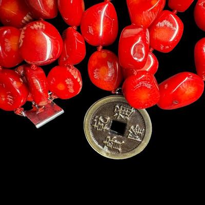 Sale Photo Thumbnail #496: Includes a raw aquamarine necklace, a red coral necklace, and a pearl necklace. Two of the necklaces have matching earrings. [ES]