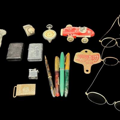 Sale Photo Thumbnail #506: Includes eyeglasses, lighters, pens, a bottle opener, an opisometer, and more. Total of 16 pieces. Pre-auction estimate: $50-$75. [KD]