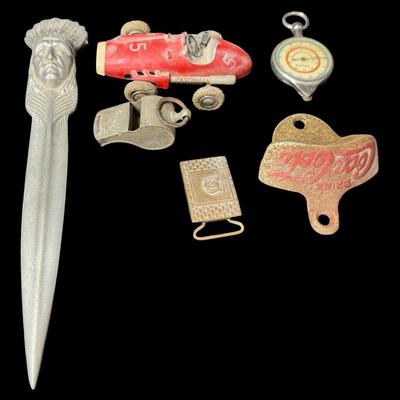 Sale Photo Thumbnail #509: Includes eyeglasses, lighters, pens, a bottle opener, an opisometer, and more. Total of 16 pieces. Pre-auction estimate: $50-$75. [KD]