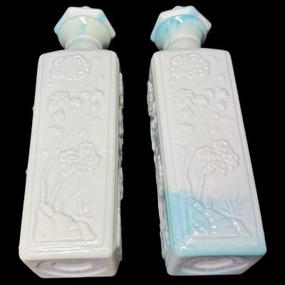 Sale Photo Thumbnail #514: Two green slag glass bottles. No obvious chips or cracks. Measurement: 12”H (each). Pre-auction estimate: $25-$50. [KD]