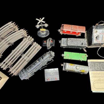 Sale Photo Thumbnail #517: Includes track, cars, locomotive parts, transformer, signal light, and more. Total of 25+ pieces. Not tested. [SR]