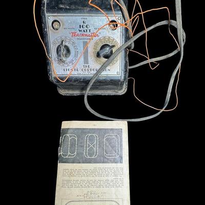 Sale Photo Thumbnail #518: Includes track, cars, locomotive parts, transformer, signal light, and more. Total of 25+ pieces. Not tested. [SR]