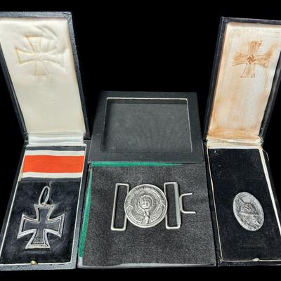 Sale Photo Thumbnail #547: Includes a WW2 German Silver Grade Wound Badge, an Iron Cross pendant, and a Waffen-SS officer’s belt buckle. Total of three pieces. [JS]