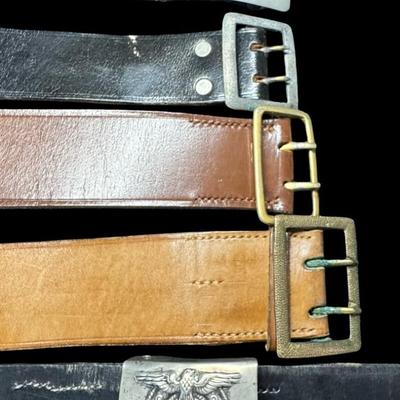 Sale Photo Thumbnail #550: Total of five leather belts with buckles. One belt has a Nazi buckle, which may or may not be original. Age related wear. [JS]