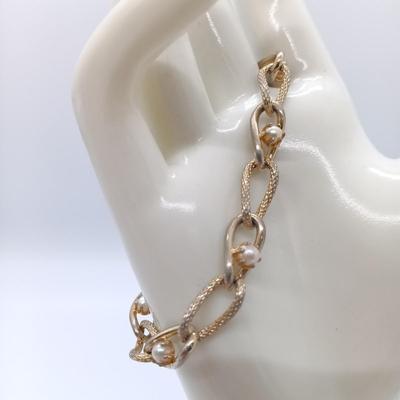 LOT 152: Vintage Gold-Tone Kellogg's Charm Bracelet, Aero Charm Bracelet, Monet Bracelet & More