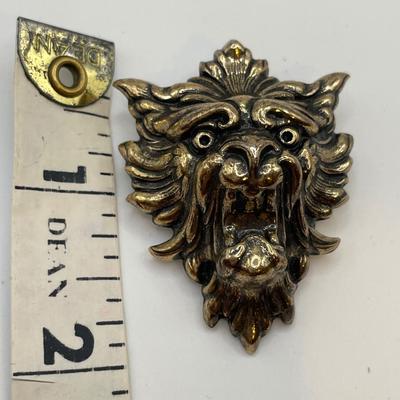 Lion head brooch