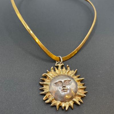 Sergio Bustamante signed sun pendant on a v shaped necklace