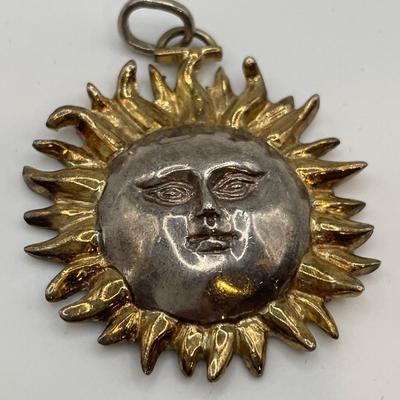 Sergio Bustamante signed sun pendant on a v shaped necklace