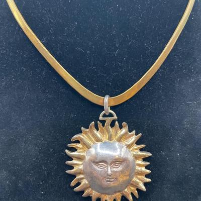 Sergio Bustamante signed sun pendant on a v shaped necklace