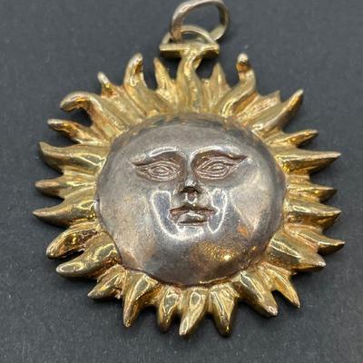 Sergio Bustamante signed sun pendant on a v shaped necklace