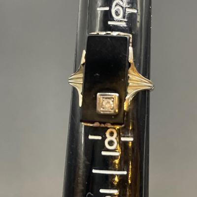 Black onyx and diamond ring