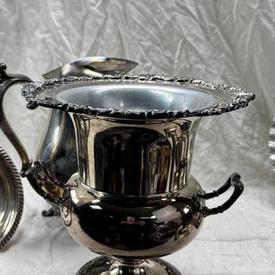 Sale Photo Thumbnail #175: 4 heavy candle sticks ( no markings) Gorham clam shell, Ice bucket, Shelffield England Pitcher and aluminim hammered plate Japan.