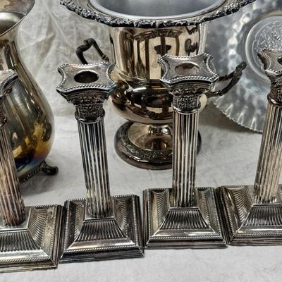 Sale Photo Thumbnail #174: 4 heavy candle sticks ( no markings) Gorham clam shell, Ice bucket, Shelffield England Pitcher and aluminim hammered plate Japan.