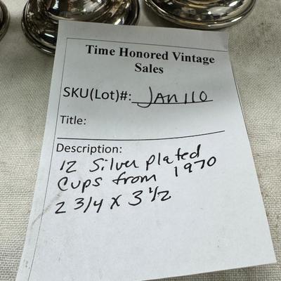 Sale Photo Thumbnail #201: These are vintage silver-plated punch cups, likely part of a larger punch bowl service. 

They are typically made of electro-plated nickel silver (EPNS). 
The cups feature a footed base and a single handle.
They are often part of a set including a punch b