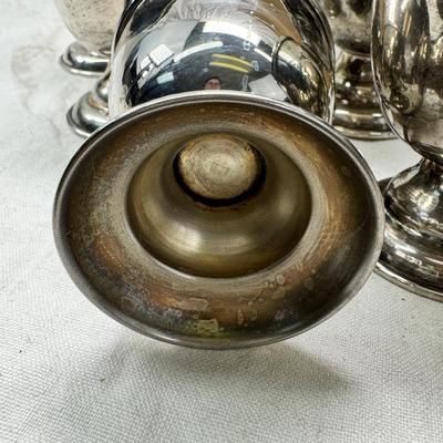 Sale Photo Thumbnail #197: These are vintage silver-plated punch cups, likely part of a larger punch bowl service. 

They are typically made of electro-plated nickel silver (EPNS). 
The cups feature a footed base and a single handle.
They are often part of a set including a punch b