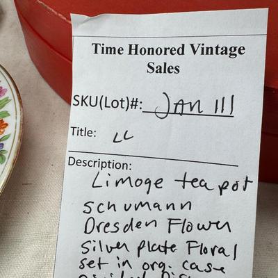 Sale Photo Thumbnail #217: Set of floral Hors d'oeuvre spoons, forks in original red case. Divided olive glass bowl with silver foot ( unmarked) 2 fine bone china tea pots one with matching plate.