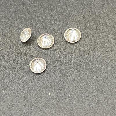 4 very small diamonds that were removed from a wedding set