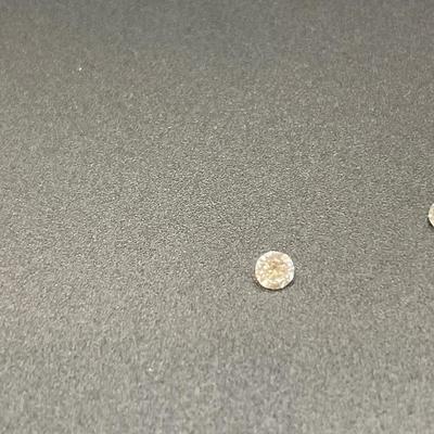 4 very small diamonds that were removed from a wedding set