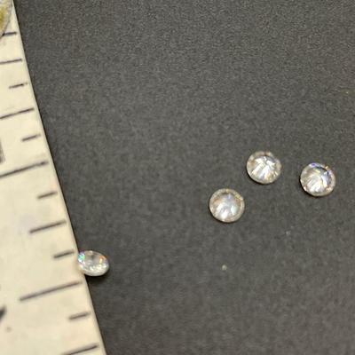 4 very small diamonds that were removed from a wedding set