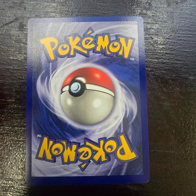 Sale Photo Thumbnail #26: 1999 Pokemon Base Set Clefairy card, numbered 5/102. Features the holographic design with 40 HP and Fairy Pokemon characteristics. Condition noted as 'light play,' indicating minor wear from handling or usage. Produced by Wizards of the Coast. A classic c