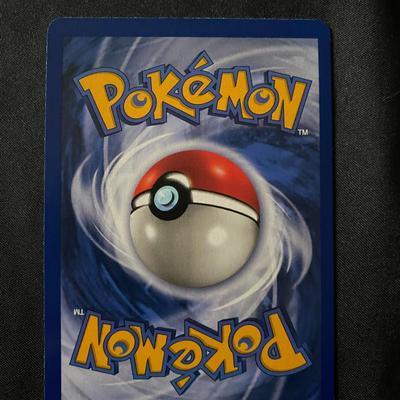 Sale Photo Thumbnail #44: Pokemon Base Set Ditto card, 3/102. Features 50 HP and the Transform Power ability. English print with a yellow-bordered design and standard back. Condition appears to be light play, meaning minor surface wear or edge wear from handling. A collectible car