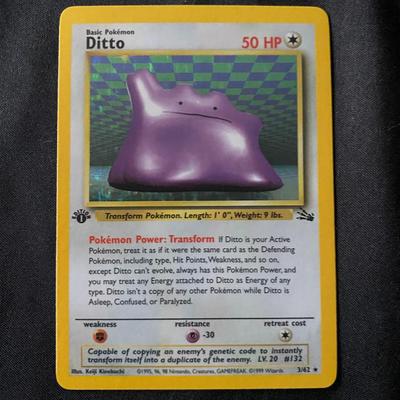 Sale Photo Thumbnail #43: Pokemon Base Set Ditto card, 3/102. Features 50 HP and the Transform Power ability. English print with a yellow-bordered design and standard back. Condition appears to be light play, meaning minor surface wear or edge wear from handling. A collectible car