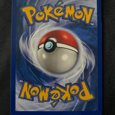 Sale Photo Thumbnail #46: 1999 Pokemon TCG Holo Ditto card from the Fossil set, featuring the Basic Ditto with 50 HP and the 'Transform' ability. Card has light play wear, as seen on both the front and back. A clean holofoil with some typical minor surface imperfections. An iconic