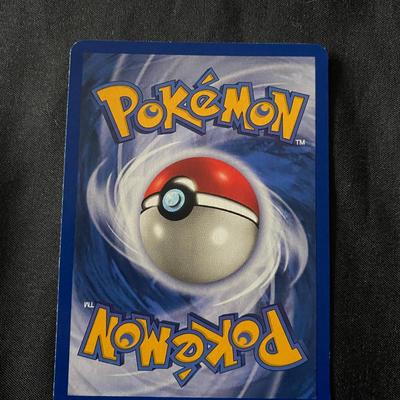 Sale Photo Thumbnail #50: 1999 Pokemon Fossil Set Ditto card, holographic rare, numbered 3/62. Features 50 HP and the unique 'Transform' ability. Light play condition with visible wear along edges and surfaces, consistent with use. Grading condition subject to professional assessm