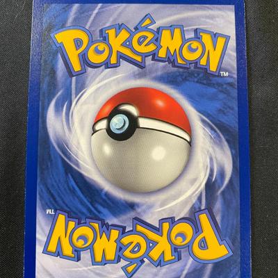 Sale Photo Thumbnail #84: Pokemon card featuring Tygnon, a holographic (holo) first edition card. Released as part of the early base set series. Text in French. Condition is marked as light play, indicating minor wear from handling. The card displays holographic elements with dist