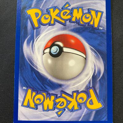 Sale Photo Thumbnail #86: This is a Hitmonchan Holo Pokemon card from the original Base Set, card #7/102. The card has a light play condition with visible signs of use but remains in collectible condition. Features holographic artwork and standard card back. A sought-after card fo