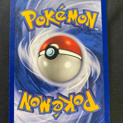 Sale Photo Thumbnail #90: Pokemon Hitmonchan holographic card from the Base Set. Numbered 7/102. Features 70 HP and attacks Jab (20) and Special Punch (40). The card is in light play condition with visible holographic foil on the illustration background. Manufactured by Wizards of