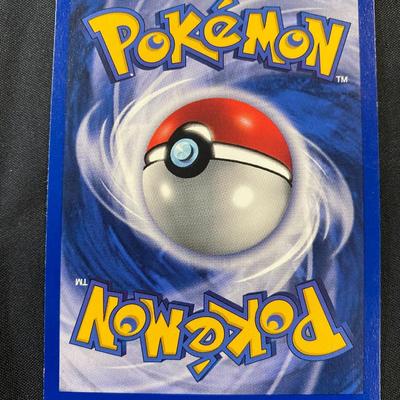 Sale Photo Thumbnail #96: Pokemon Trading Card Game Base Set Holo Hitmonchan card, #7/102. Features holographic artwork with 70 HP. Manufactured by Wizards of the Coast in 1999. Condition is classified as light play with signs of minimal use. Iconic card from the original Base Set