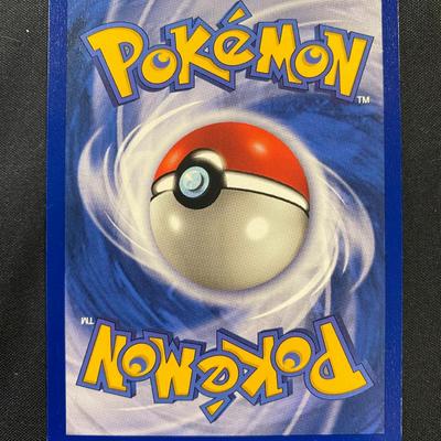 Sale Photo Thumbnail #122: This is a holographic Nidoking card from the Pokemon TCG Base Set. The card has 90 HP and features the attacks Thrash and Toxic. It is numbered 11/102 and manufactured by Wizards of the Coast in 1999. Condition is light play with minor wear visible.