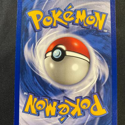 Sale Photo Thumbnail #126: Pokemon Base Set Ninetales holographic card, 1999 release. Features 80 HP and moves such as Lure and Fire Blast. Card number 12/102. Condition is light play with some visible handling marks. A key collectible for fans of the original set.