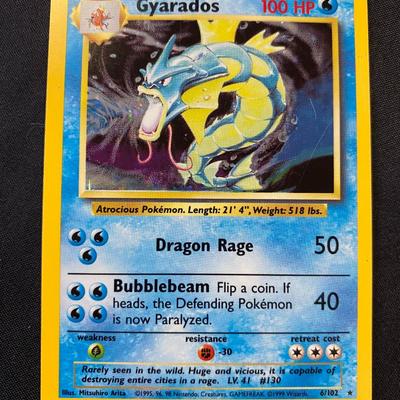 Sale Photo Thumbnail #139: Pokemon Base Set Holo Gyarados card. Features a holofoil graphic and is marked #6/102. Released in the original Base Set (1999). Card condition is assessed as light play with signs of handling and wear consistent with this grade. All details and graphics 