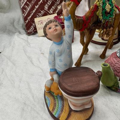 Sale Photo Thumbnail #220: Purple bohemian glass vase with small chip in rim, Resin camel 4 working music boxes, 1 Christmas snow globe.