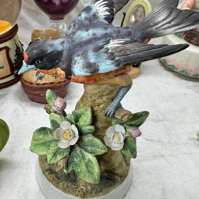 Sale Photo Thumbnail #227: Purple bohemian glass vase with small chip in rim, Resin camel 4 working music boxes, 1 Christmas snow globe.